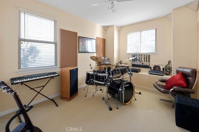 misc room featuring ceiling fan and carpet floors