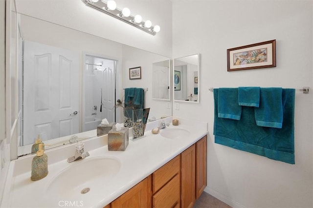 bathroom with vanity, bathing tub / shower combination, and tile patterned flooring