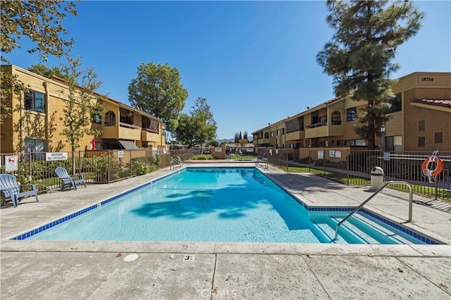 view of swimming pool with a patio