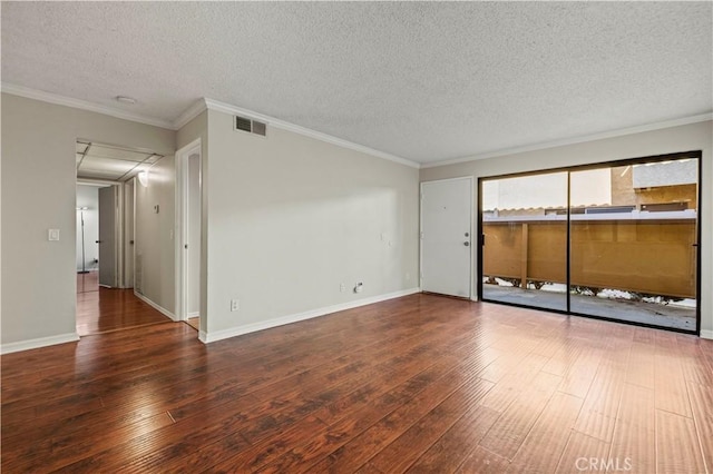 unfurnished room with dark wood-type flooring, ornamental molding, and a textured ceiling