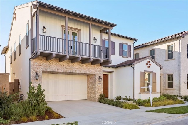 view of front of house with a garage and a balcony