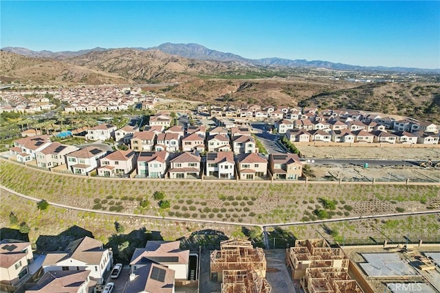 birds eye view of property featuring a mountain view