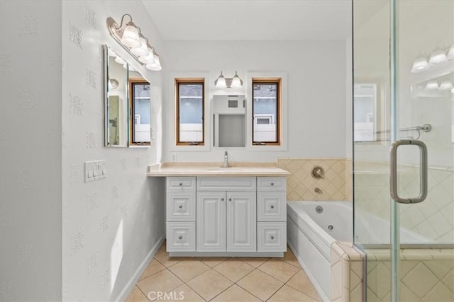 bathroom featuring tile patterned floors, vanity, and shower with separate bathtub