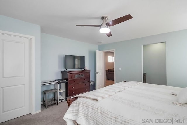 carpeted bedroom with ceiling fan