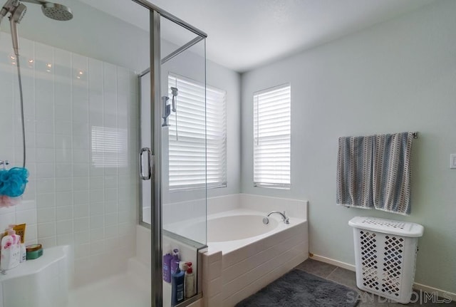 bathroom featuring plus walk in shower and tile patterned floors