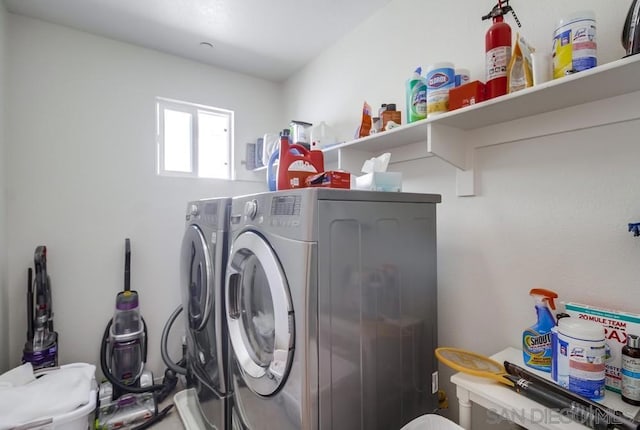 clothes washing area featuring washer and dryer