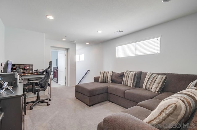 carpeted living room with a healthy amount of sunlight