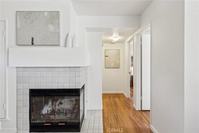 hallway with hardwood / wood-style flooring