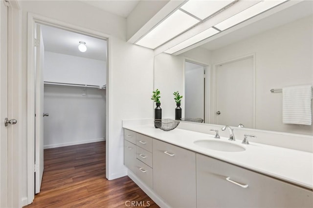 bathroom with wood-type flooring and vanity