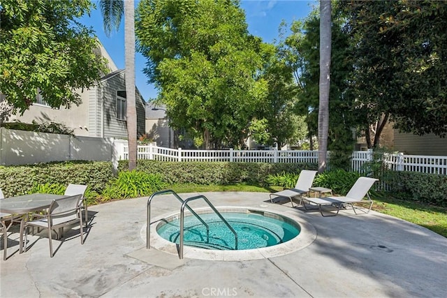 view of pool with a patio and a community hot tub