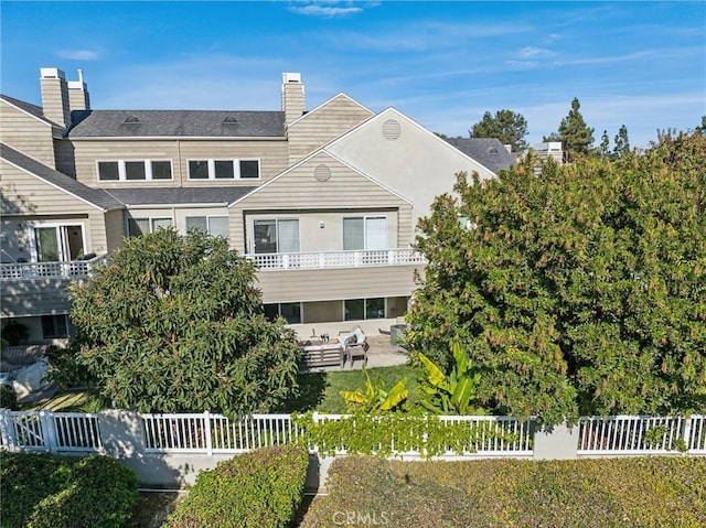 rear view of house featuring a patio area