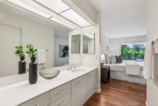 bathroom featuring hardwood / wood-style floors and vanity