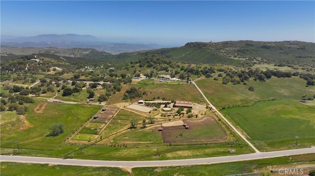 aerial view featuring a rural view and a mountain view