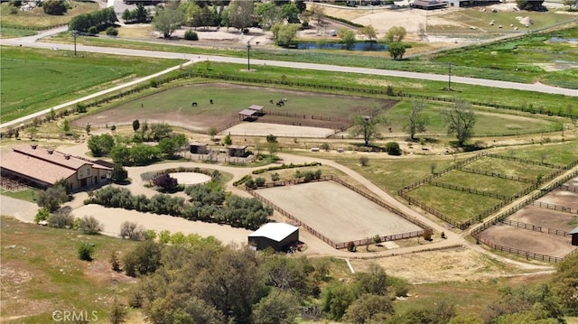 birds eye view of property with a rural view