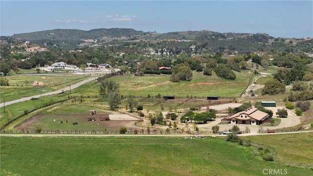 bird's eye view featuring a mountain view and a rural view