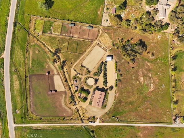 birds eye view of property with a rural view