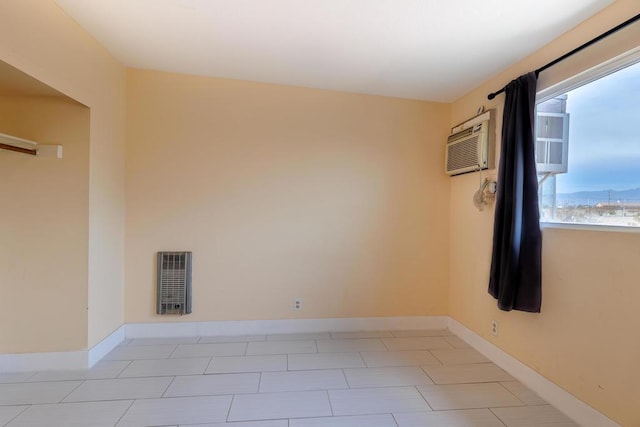 unfurnished room featuring a wall mounted air conditioner