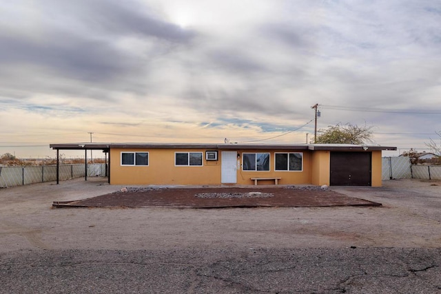 view of front of home featuring a carport