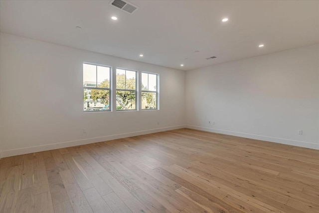 unfurnished room with light hardwood / wood-style flooring