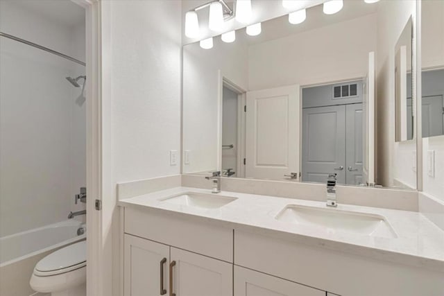 full bathroom with toilet, vanity, and shower / bathing tub combination