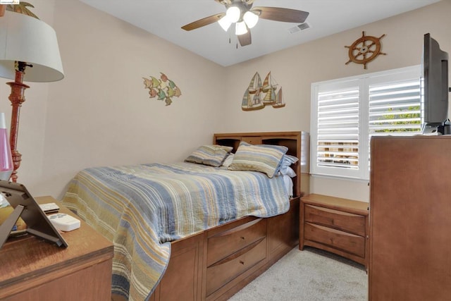 carpeted bedroom featuring ceiling fan