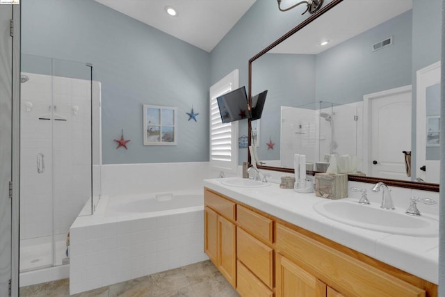 bathroom featuring vanity and separate shower and tub