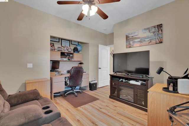 office with ceiling fan and light hardwood / wood-style flooring