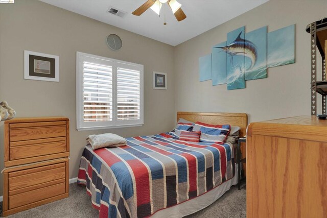 carpeted bedroom with ceiling fan