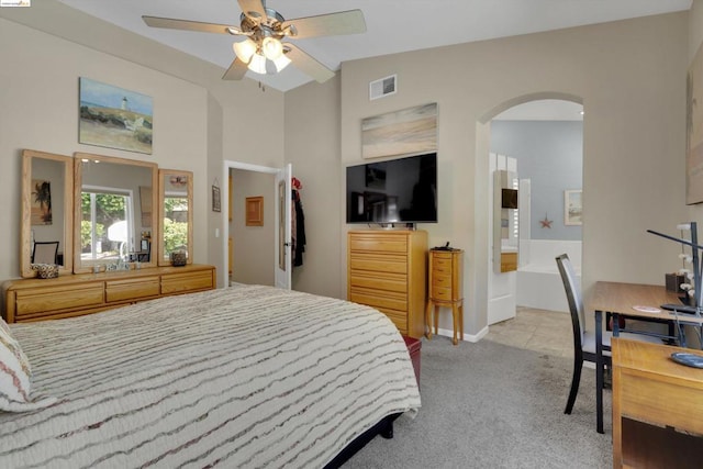 bedroom featuring ceiling fan, light colored carpet, and lofted ceiling