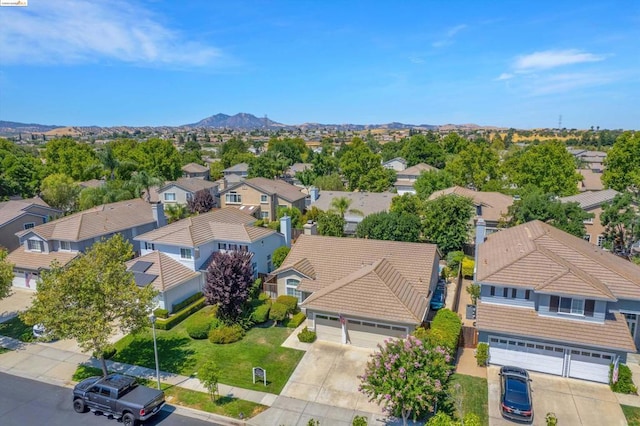 birds eye view of property featuring a mountain view