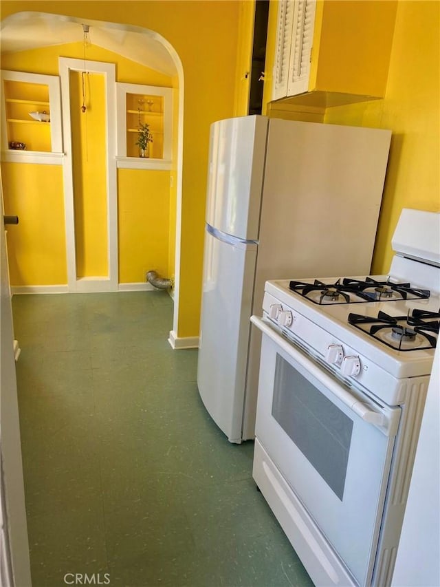 kitchen with white gas range