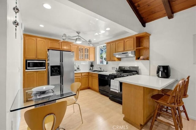 kitchen with lofted ceiling with beams, black appliances, kitchen peninsula, wooden ceiling, and light hardwood / wood-style flooring