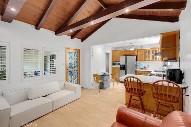 living room with beam ceiling, high vaulted ceiling, wooden ceiling, and light hardwood / wood-style floors