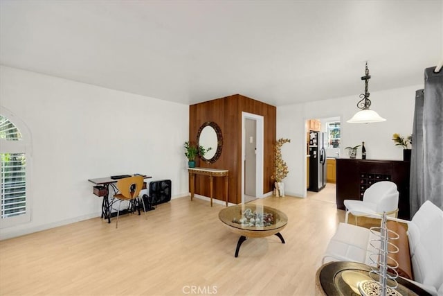 living area with hardwood / wood-style flooring