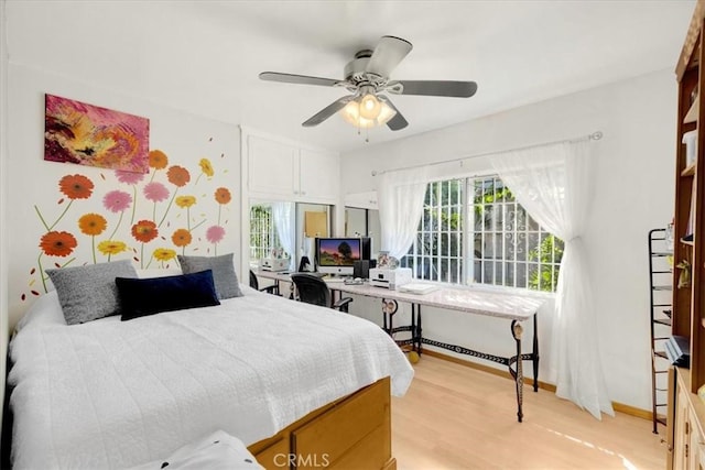 bedroom featuring light wood-type flooring and ceiling fan