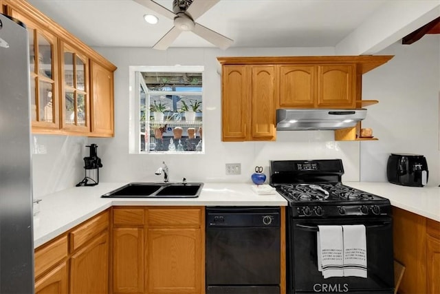 kitchen with sink, black appliances, and ceiling fan