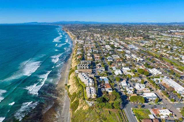 drone / aerial view with a water view and a view of the beach