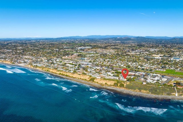 bird's eye view with a water and mountain view and a view of the beach