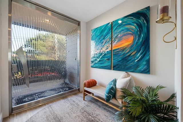 sitting room with hardwood / wood-style flooring