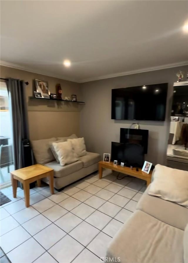 living room featuring light tile patterned flooring and crown molding