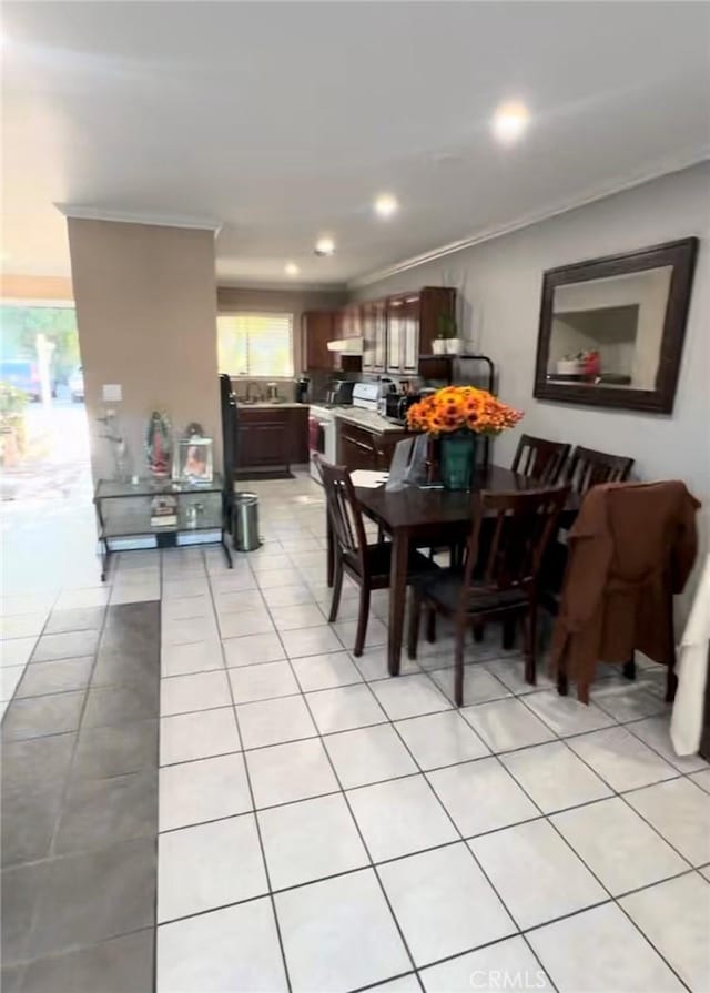 tiled dining area with crown molding