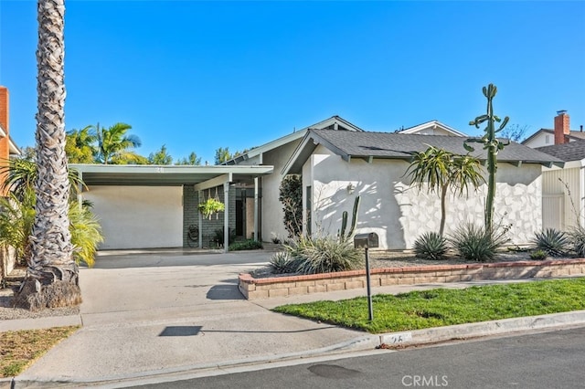 view of front of home featuring a carport