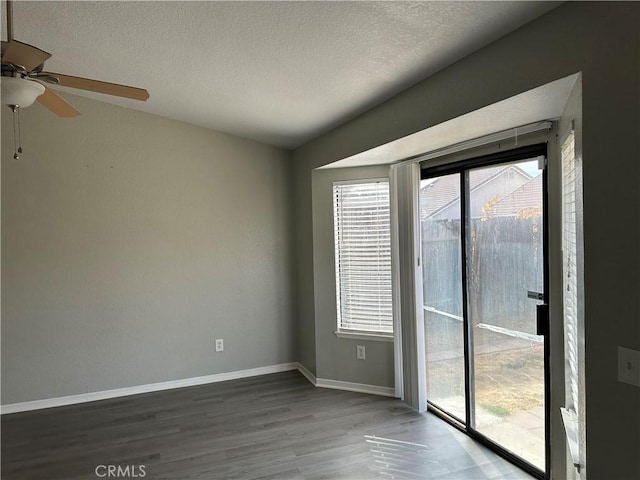 unfurnished room featuring a textured ceiling, ceiling fan, and hardwood / wood-style flooring