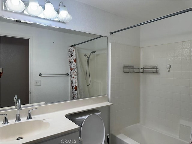 full bathroom with toilet, vanity, and shower / tub combo with curtain