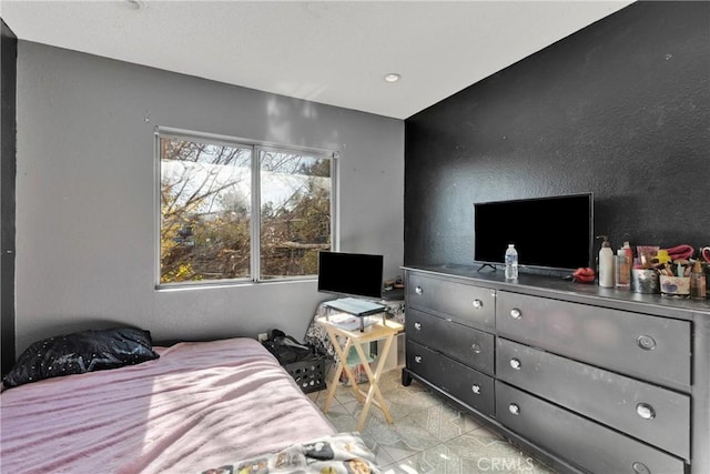 bedroom with light tile patterned flooring