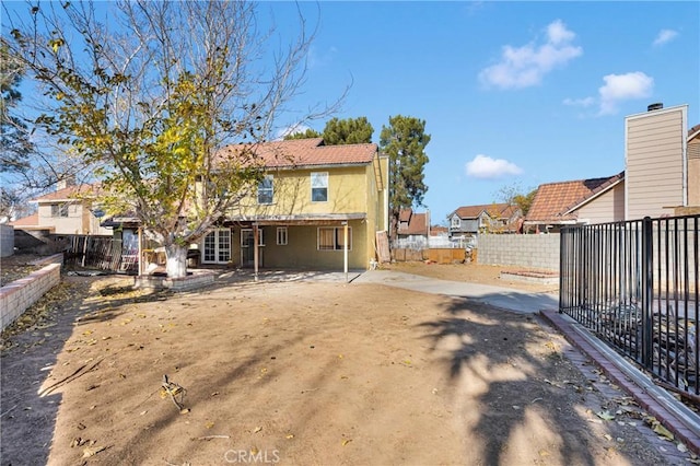 rear view of property with a patio