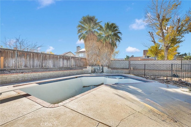 view of pool with a diving board and a patio