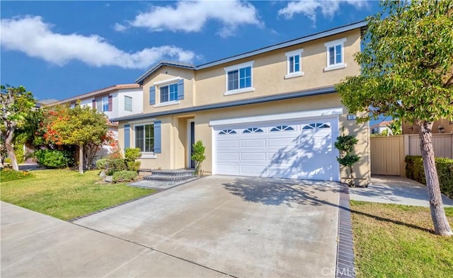 view of front of home with a front yard and a garage