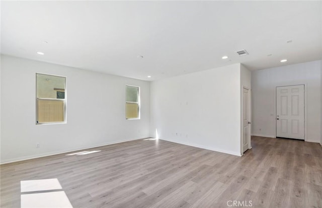 empty room with light wood-type flooring