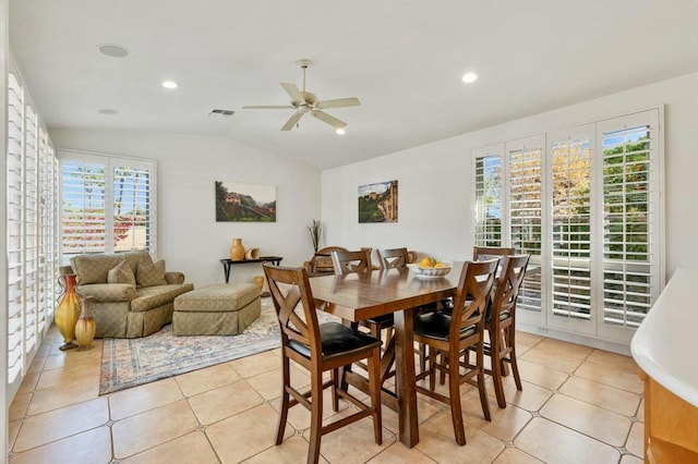 dining area with light tile patterned flooring, ceiling fan, lofted ceiling, and plenty of natural light